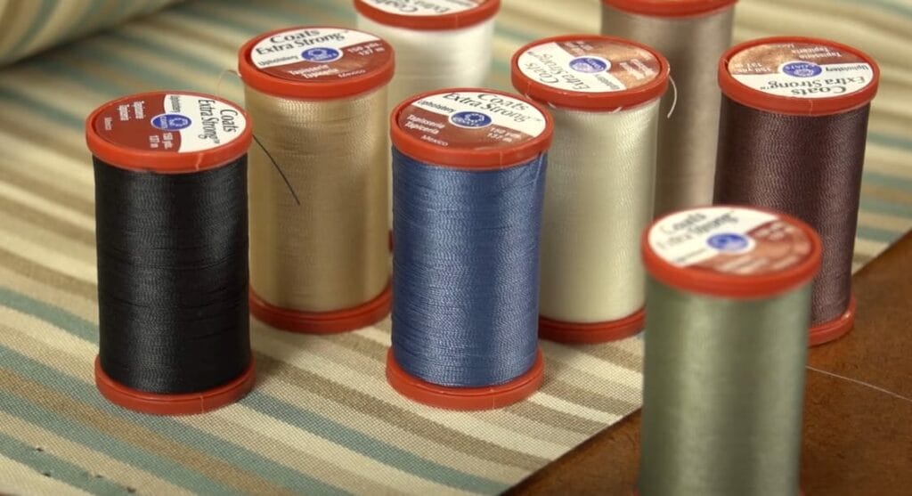 Assorted spools of colorful thread for sewing