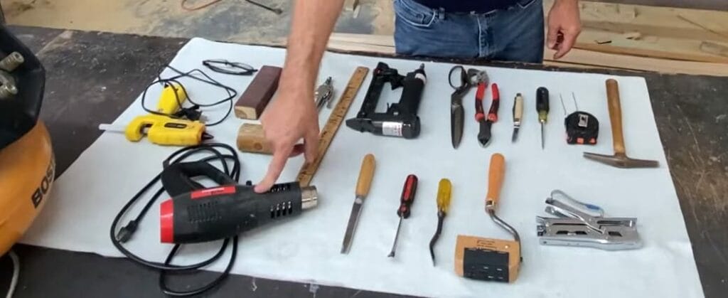 A person showing on the table the tools for construction
