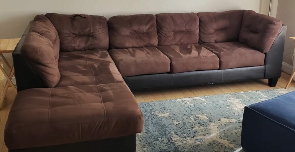 A brown sectional sofa in a living room