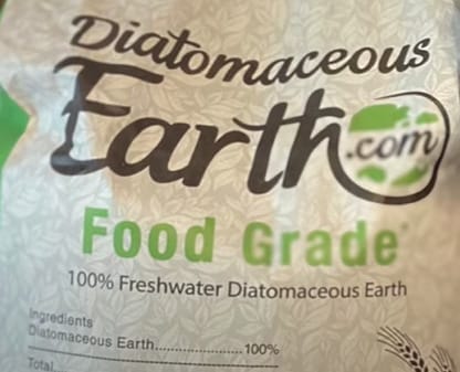 A bag of ultimate earth food grade is sitting on a table