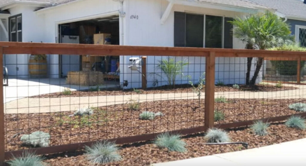 a finish result of a newly install hog wire fence
