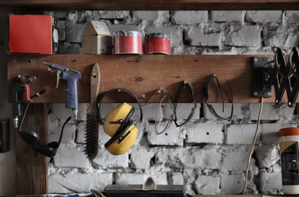 A different home and safety tools neatly stored and hang on a wooded shelf