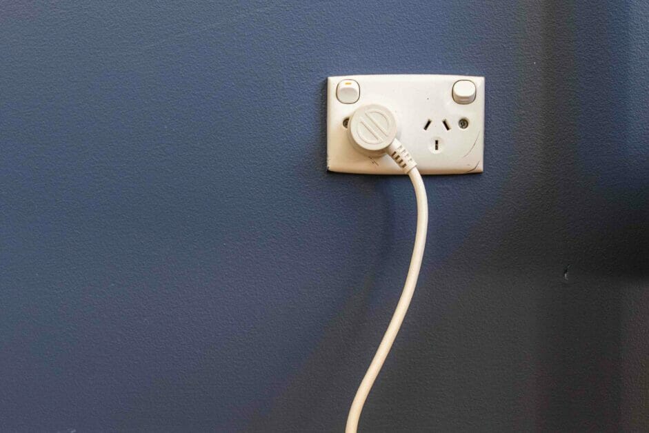 Outlet on a dark grey blue wall