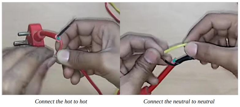 A person is demonstrating how to connect a wire to a plug