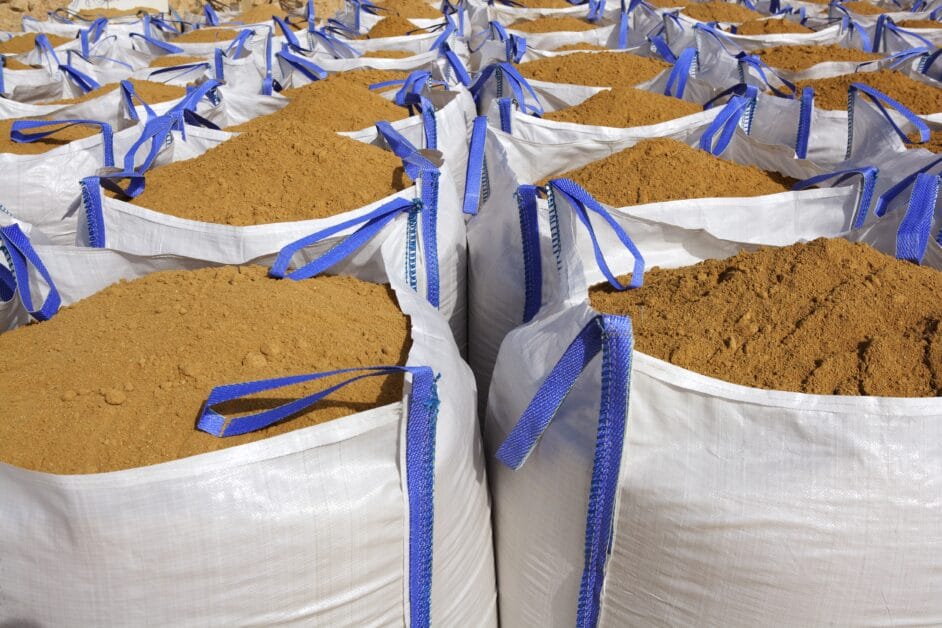A piled bags of sand lined up