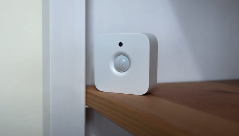 A motion sensor light on a cabinet shelve