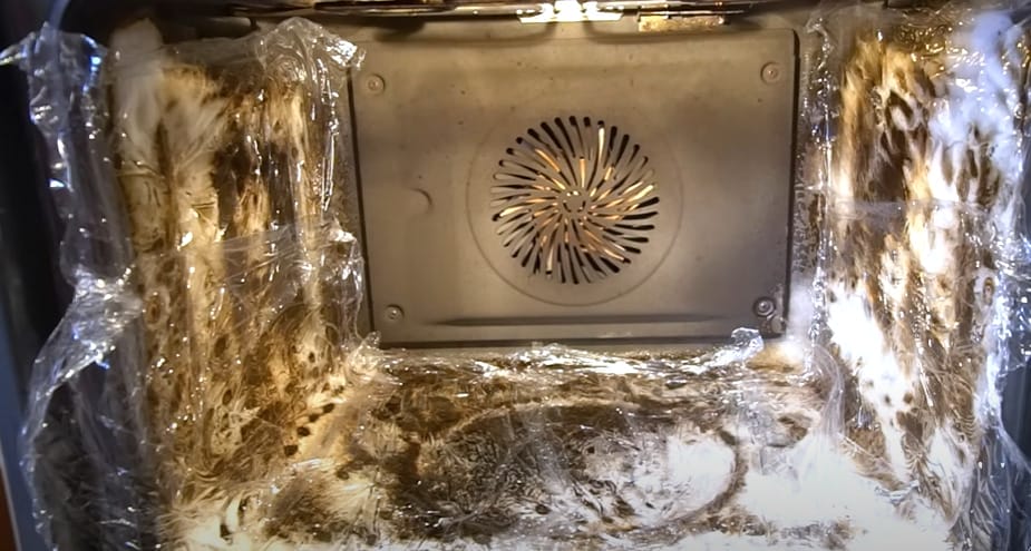 An oven with a plastic cellophane