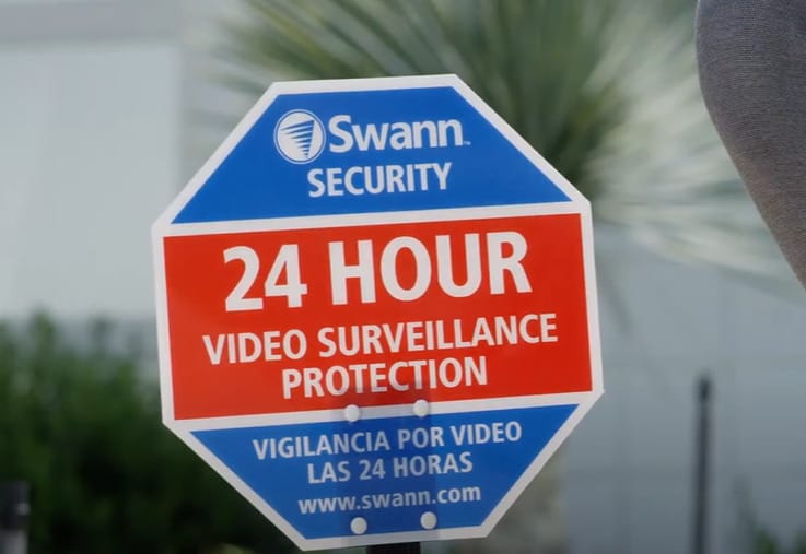 A Swann Security 24 hour video surveillance protection sign