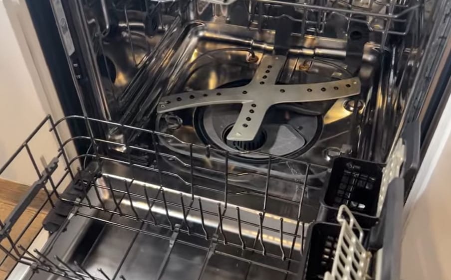 A rack and the inside of a dishwasher