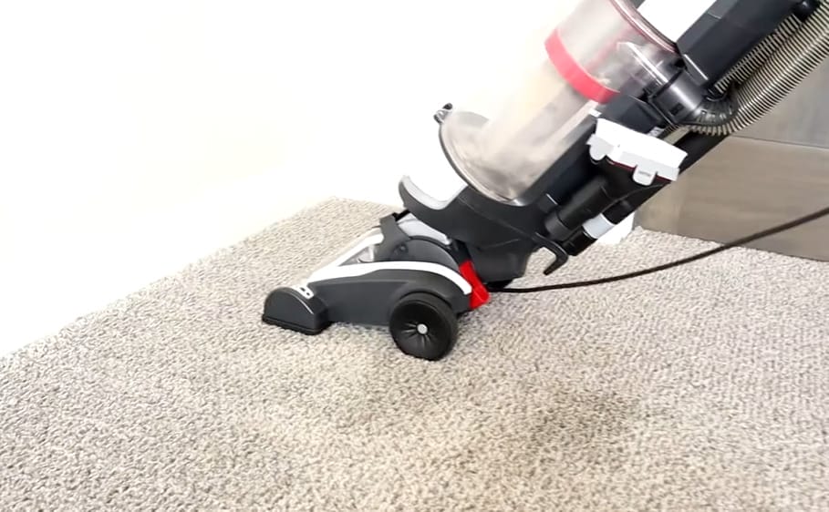 A vacuum cleaner for a carpet