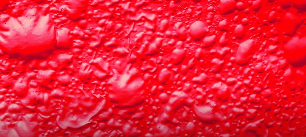 A red bubbling paint on the wall