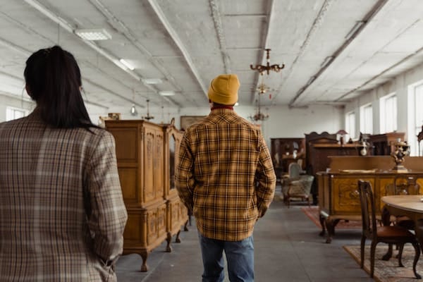 A man and woman inside a furniture shop