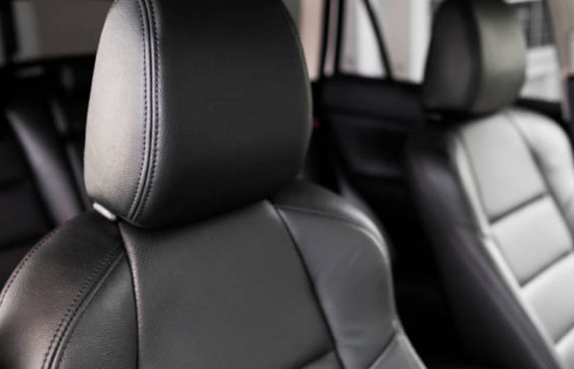The interior of a car with black leather seats