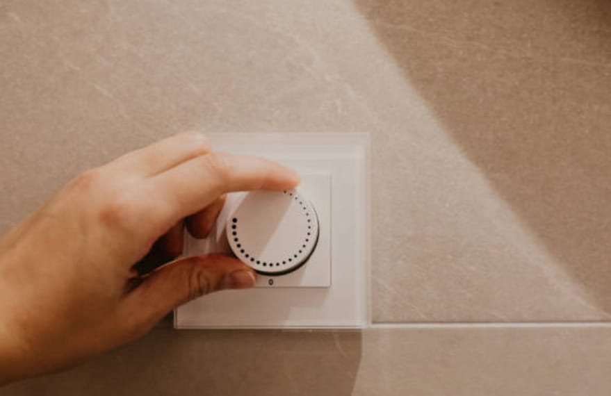 A person is checking the energy-saving dimmer switch