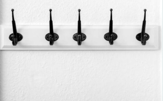 Five hooks solve the problem of organizing closets by hanging on a wall