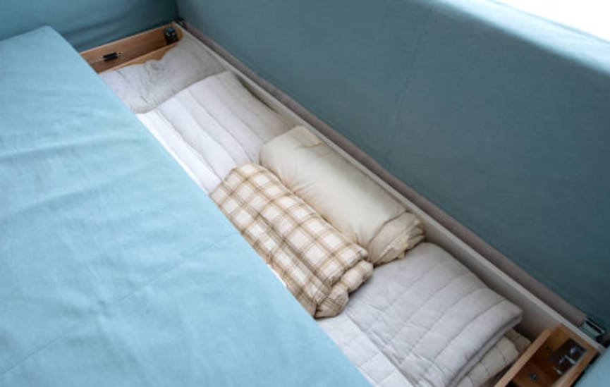A bed with storage section at the bottom