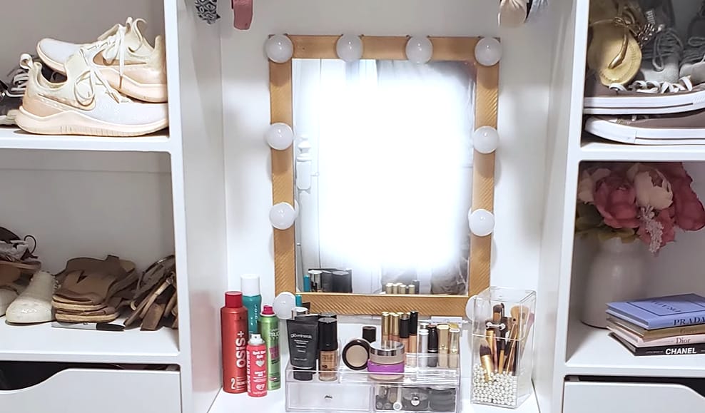 A clutter-free closet with a mirror, makeup, and shoes, showcasing efficient closet organization hacks