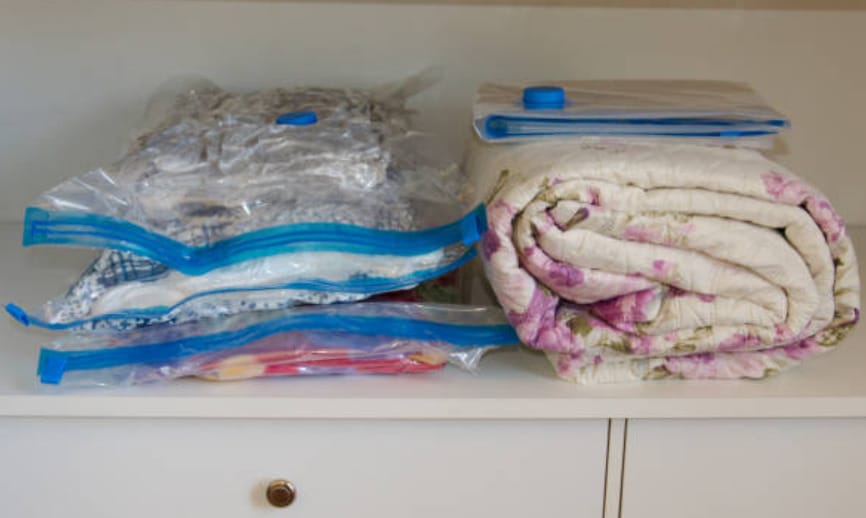 A blankets and clothes in a vacuum storage bags