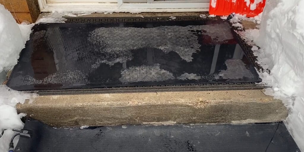 A snow melting on the door mat outdoor