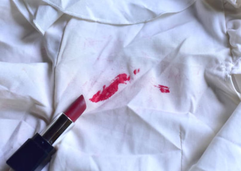 A lipstick stained a white sheet