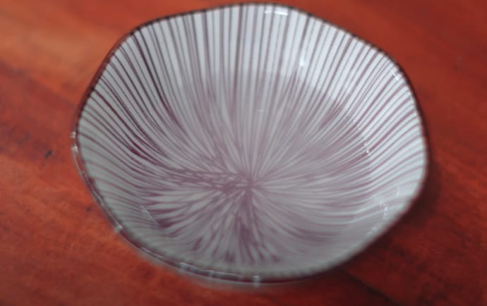 A white vinegar in a printed bowl