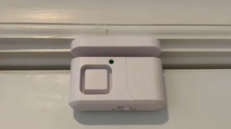 A security alarm mounted at the wall ceiling