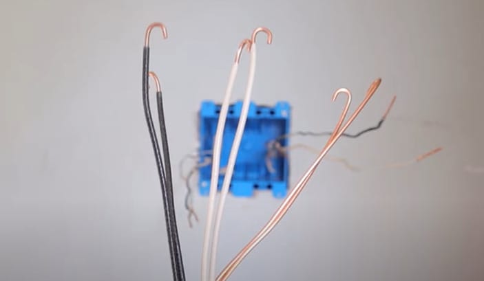 A stripped wire of black, white and brown wires