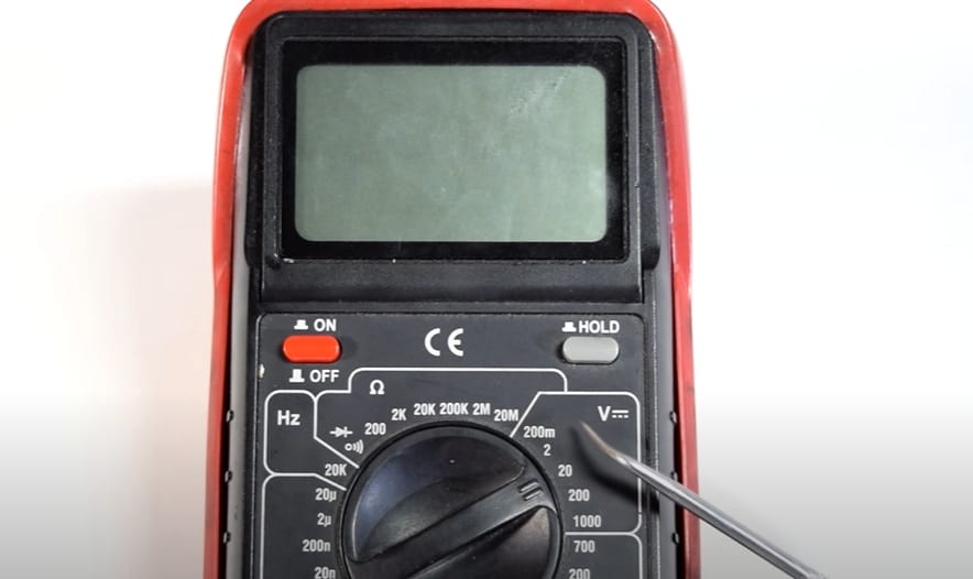 A multimeter in red and black color