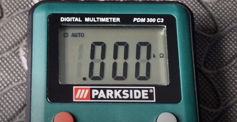 A PARKSIDE green digital multimeter showing a .000 reading on the screen