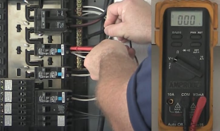A 000 reading on the multimeter as the man testing the circuit breaker in a main panel