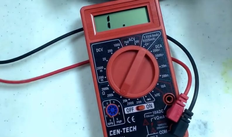 A Cen Tech multimeter with wires connected to it