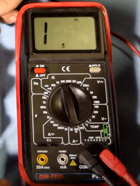 A multimeter at 1 reading on the screen