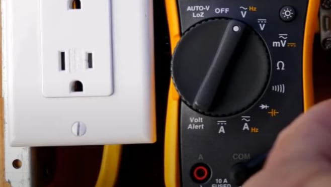 An outlet with multimeter on the side