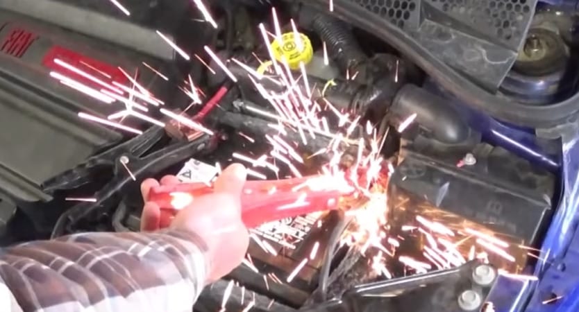 A spark cause by a person doing a direct terminal connection on a car battery