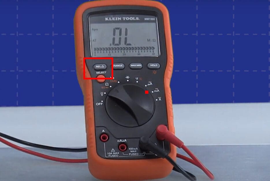 A multimeter is shown on a blue background, highlighting its capacitance symbol
