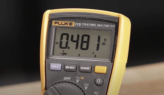 A digital multimeter at 0.481 reading in it