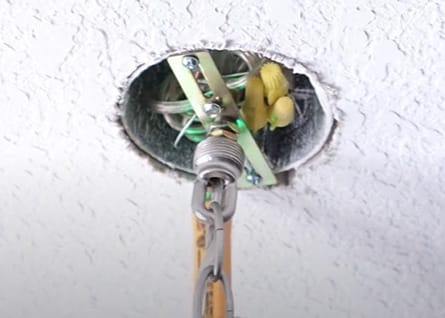 An undone ceiling fan wires