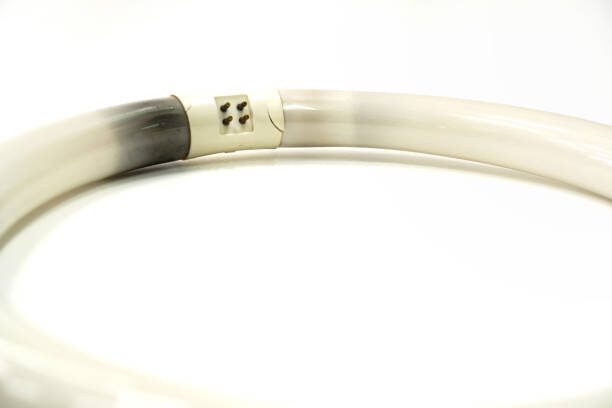 A white and black horn bangle on a white surface