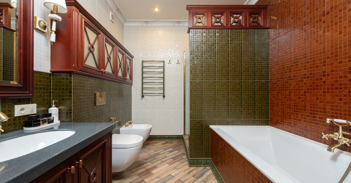 a beautifully designed traditional bathroom featuring luxurious fixtures and classic tiles