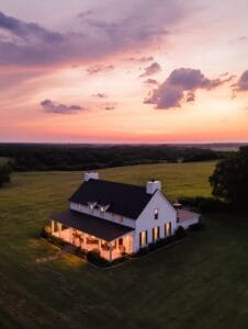 Tour This Dreamy New England Farmhouse With Wraparound Porch โ Inside the 72โFt Porch & Cozy Interiors