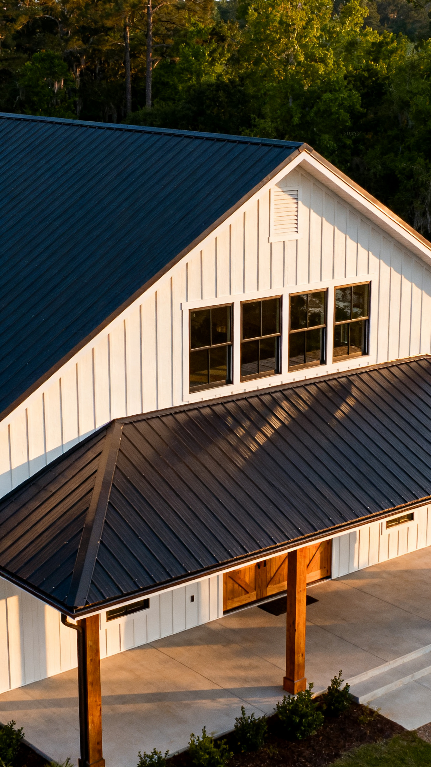 Simple gabled roofline on a South Carolina barndominium with dark metal roofing
